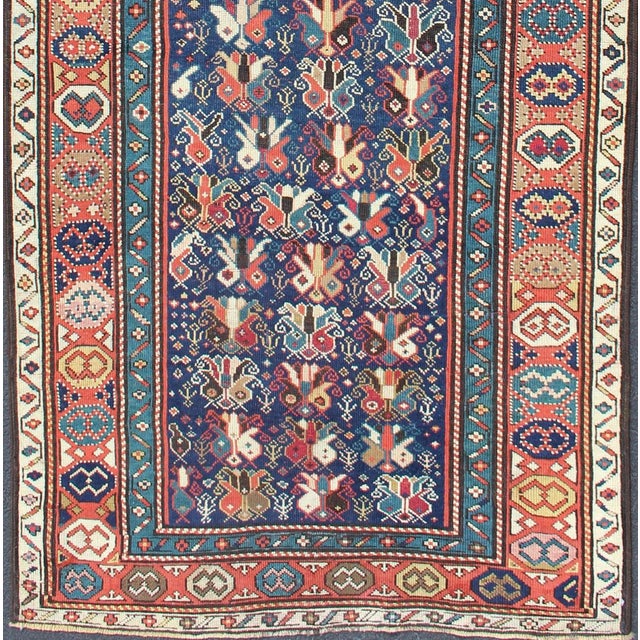 Measures: 3'7 x 9'1. Antique Caucasian Gendje Runner Rug with Lattice Design in Blue and Red Tones. Keivan Woven Arts /...