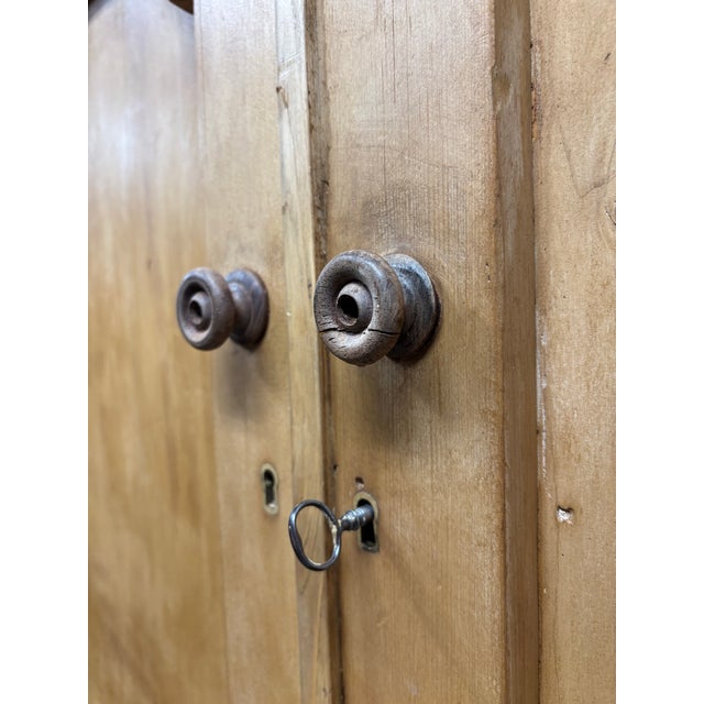 There is a quiet grandeur to a proper linen press — a piece built to organize the private rhythms of a household, yet...