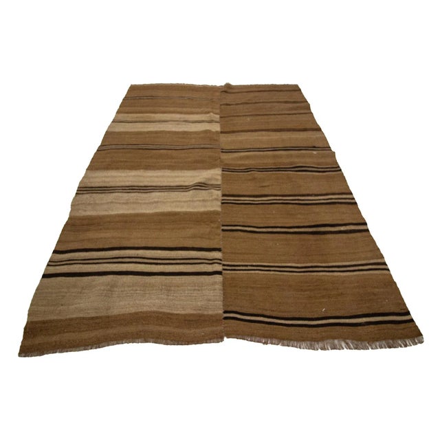 Handwoven vintage wool kilim rug from Kars region of Turkey. Approximately 50-60 years old. In very good condition