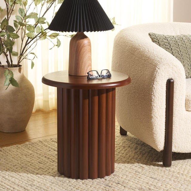The Monka End Table introduces warm rustic charm through its walnut tone and clean, timeless design that enhances any...