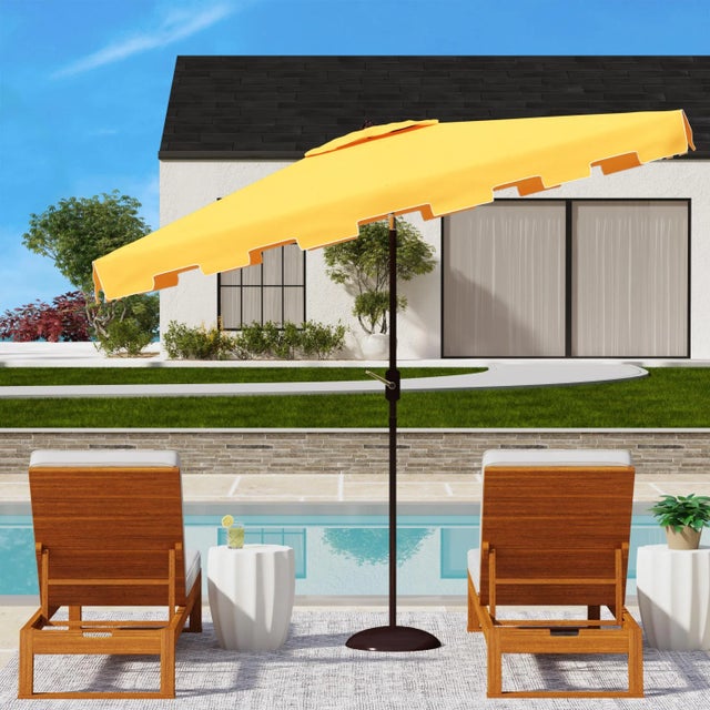 A classic market umbrella gets a stylish makeover in yellow and white for chic European flair. Its rectangleangular...
