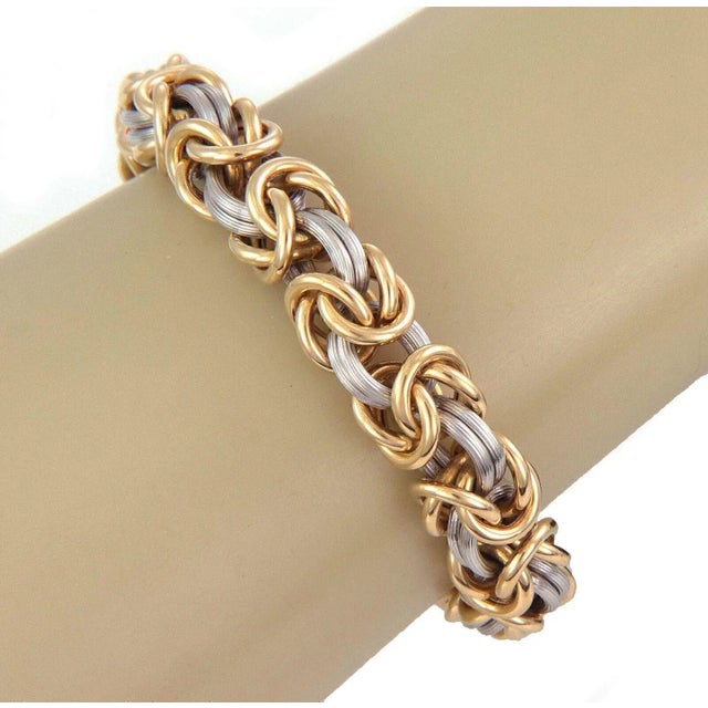 The Rom Germany 18k Yellow Gold & Platinum Byzantine Link Bracelet is a stunning piece of fine jewelry signed by the brand...