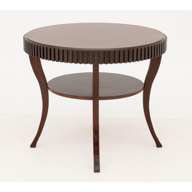 Barbara Barry Attributed Mahogany Circular Table, with fluted apron above circular undertier on four cabriole legs. 30.25"...