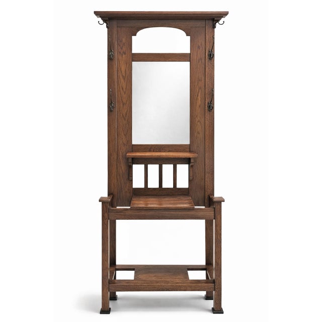 Discover the timeless elegance of this meticulously crafted Arts and Crafts Mission style oak hall tree. Dating back to...