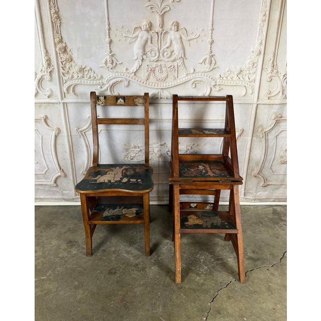 A charming and highly functional pair of handcrafted convertible step ladder chairs featuring whimsical hand-painted dog...