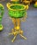 This elegant French style cachepot features a rich green porcelain finish beautifully accented with luxurious gold leaf...