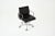 Black leather office chair with aluminum base and wheels. It turns on itself. Stamped ICF. Dimensions: Seat height 51cm....