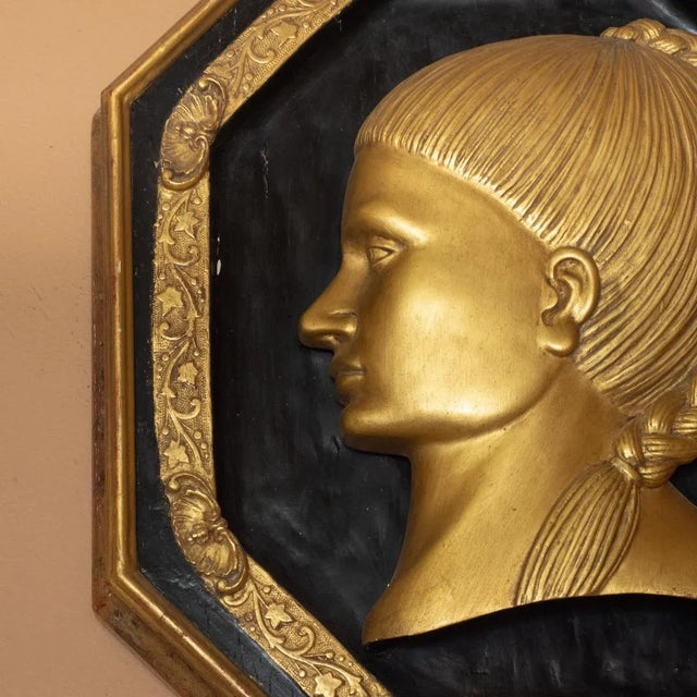 Pair of 22kt gold leaf woodcarving female portraits with filigree borders by master woodworker Carlos Villegas.