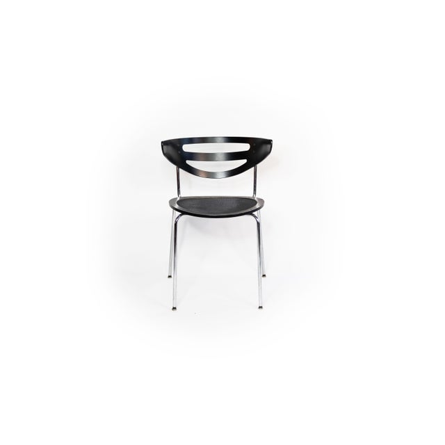 This vintage chair from the 1990s stands out with its clean lines, durable materials, and distinctive silhouette. The seat...