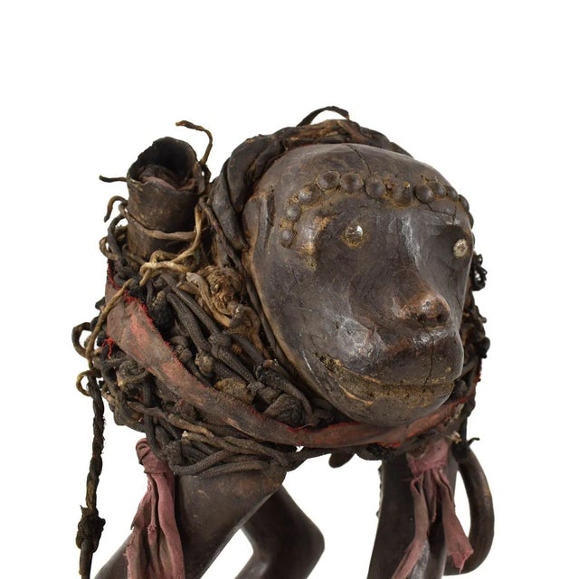 An exquisite Makonde Figure adorned with fabrics, metal, vegetable fibers, and shells.Makonde are widely well-known for...