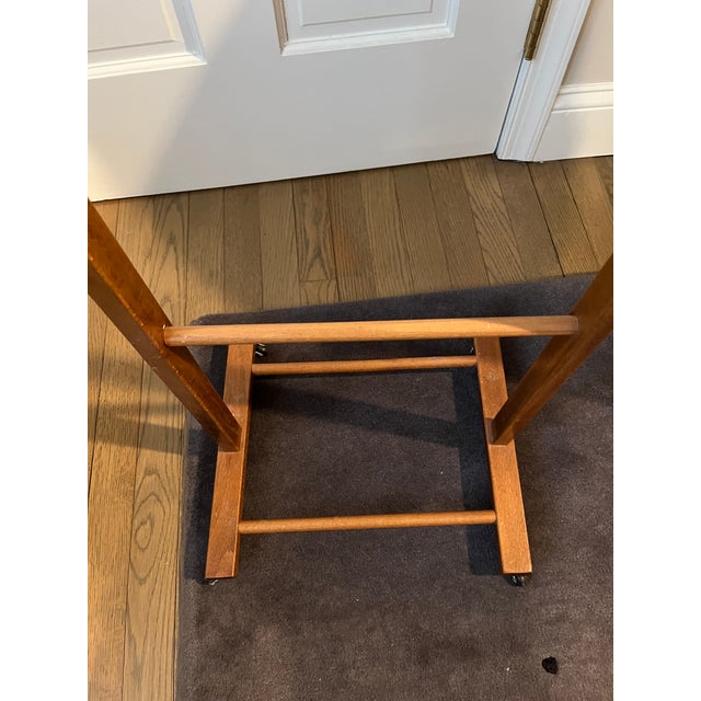 This eye catching Italian made wood valet stand is so attractive that it could pass for a sculpture or work of art....