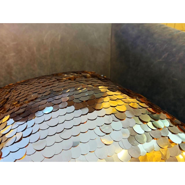 The density of the sequins gives the cover a noticeable weight and a movement quality that standard fabric cushions do not...