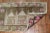 mid 20th century Turkish Anatolian mini rug depicting a mosque in neutral tones withPops of pink wool too.