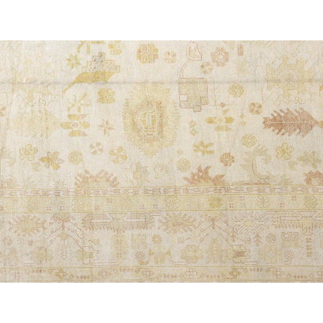 Experience the rich history and artistry of Turkish rugs with our Vintage Turkish Oushak Rug. This handwoven masterpiece,...