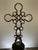 This one-of-a-kind assemblage sculpture pairs a clear rectangular glass bottle with a handcrafted cross composed of...