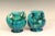 Pair Awaji Pottery "muscle" vases in Art Deco form with outstreched handles and frothy blue green flambe glaze, circa...