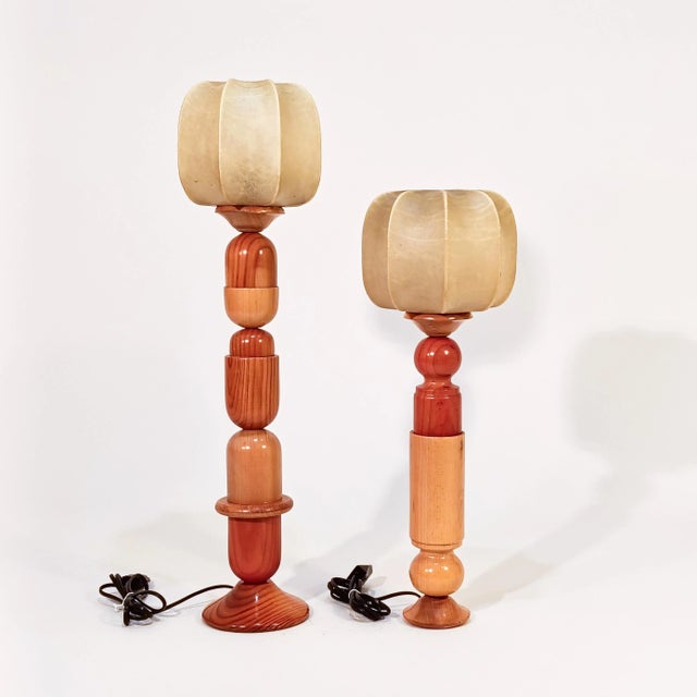 Pair of sculptural Italian cocoon table or table lamps, 1970s. Bodies formed by the superimposition of several varnished...