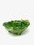 A small leaf-shaped bowl finished with a gilded branch handle, hand-painted in Italy. As hand-painted work, expect slight...