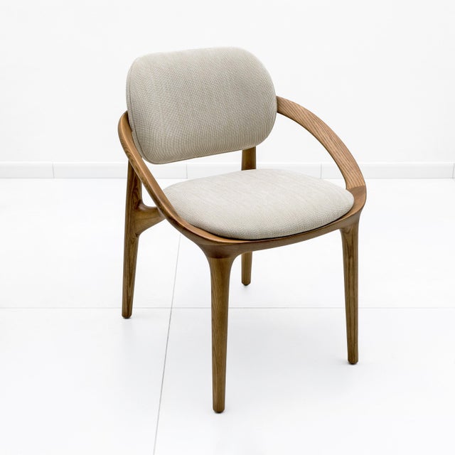 Elegant set of six Italian dining chairs in ash wood, featuring a refined sculptural frame with soft, curved lines. The...