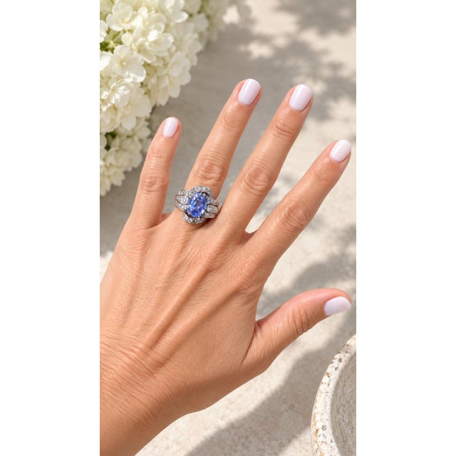 This striking designer ring by Paul Matthews blends antique inspiration with modern craftsmanship. At its center rests a...