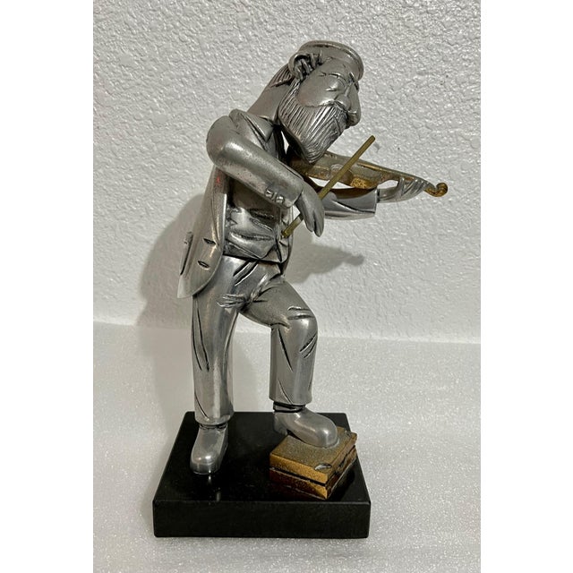 Rare Vintage unusual piece. In this bronze or metal sculpture by Frank Meisler, the artist depicts a Klezmer violin player...