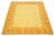 Hand-knotted Tibetan wool rug featuring a warm golden field with stylized floral and geometric motifs. The rich orange...