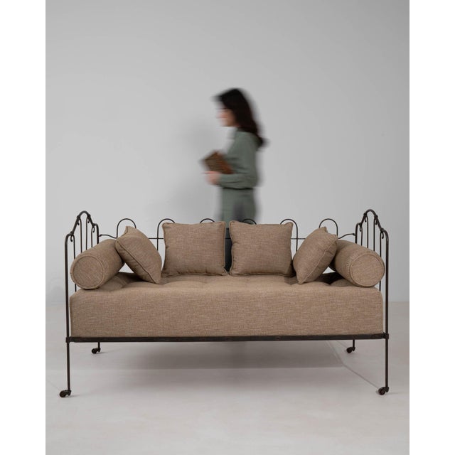 A bench whose black wrought iron, castor wheel gives it real character at first glance. The piece dates to 1900s, sourced...