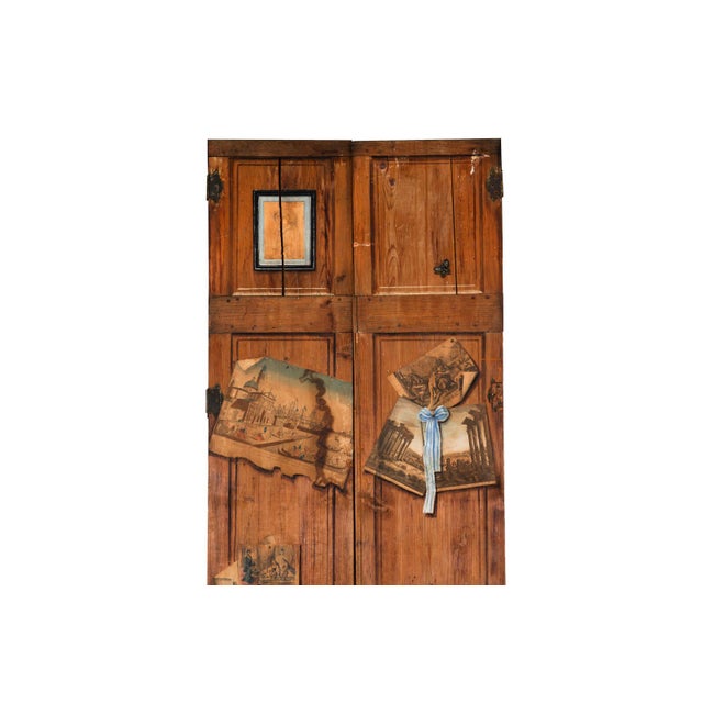 PAIR OF FRENCH SCRUBBED AND WORN PINE TENON-MORTISED DOORS With decoupage & trompe l'oeil decoration throughout, 19th...