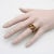 This is part of Chairish’s Fine Jewelry assortment. This is a classic 9k gold snake ring that has two beautiful rhodolite...