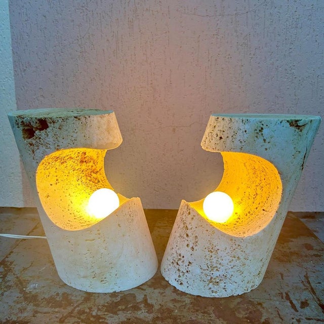 A rare pair of sculptural travertine table lamps designed by Giuliano Cesari for Nucleo, a division of Sormani S.p.A.,...