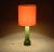 Very colorful table lamp. Green base and orange shade. The designer can be Bengt Orup or Gert Nyström for Hyllinge Glass...