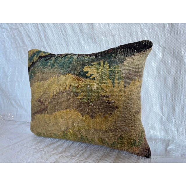 This pillow is made from a genuine fragment of a 17th century Flemish tapestry, offering a rare chance to live with a...