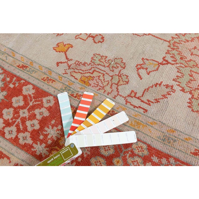 Rich in artistic heritage and regional charm, this antique Turkish Oushak rug from the early 20th century radiates both...