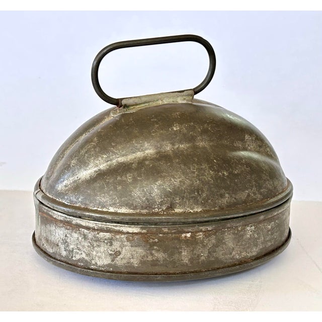Antique tin melon-shaped mold, used for steaming sweet or savory dishes; puddings, cakes, or molding gelatin desserts....