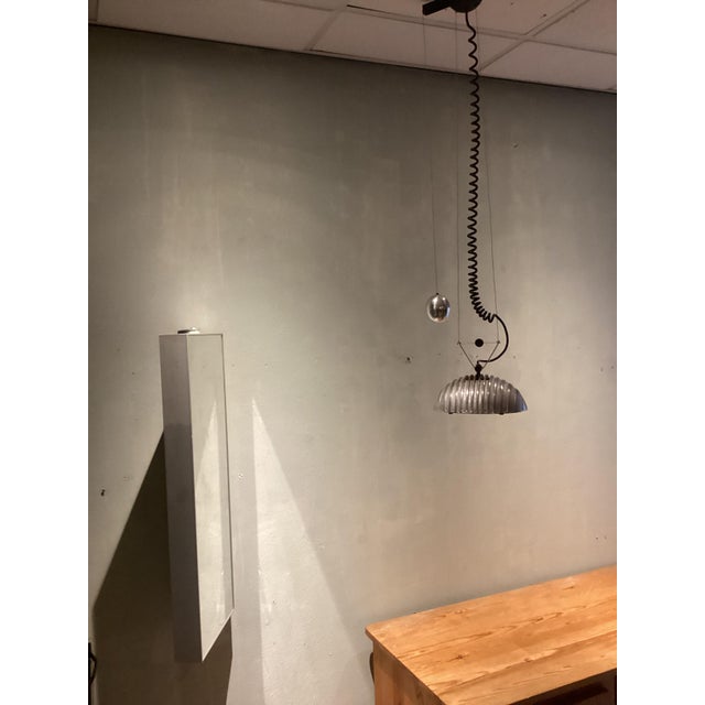 Nice designed, industrial, modern piece, cast aluminium ,and Glass plate under it. Moveble in height from 110 to 165cm...