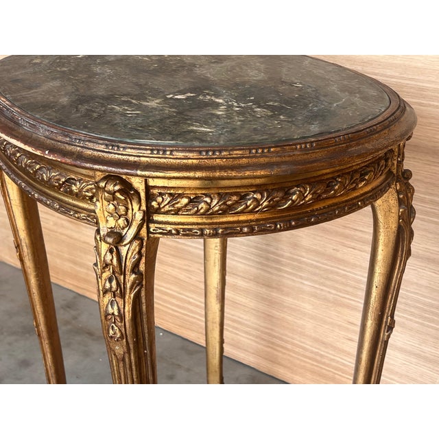 French Louis XVI style oval dining table from Paris decorated with timeless classical styling and hand carved excellence...