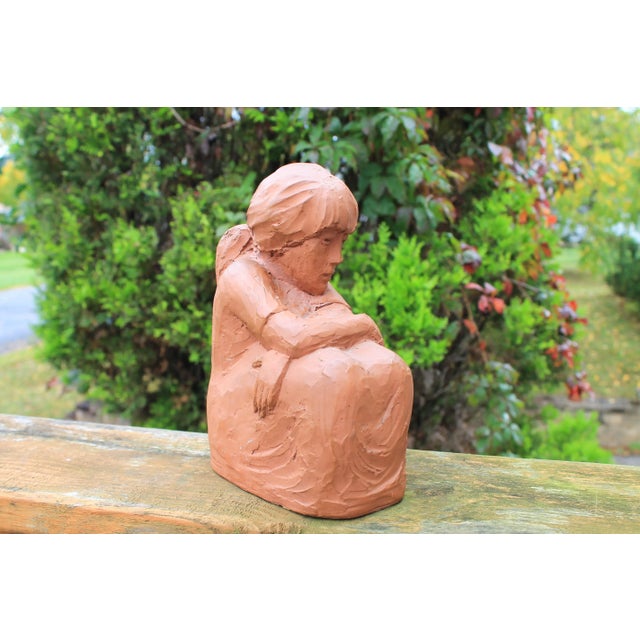 Vintage clay sculpture of a girl in deep thought. Makers mark on back. Made by SC Lerma in Spain.