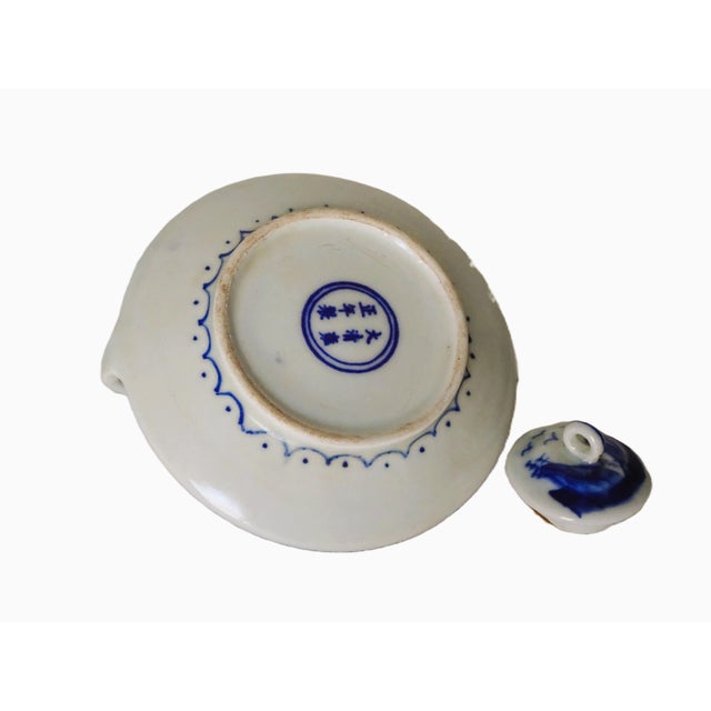 Beautifully painted and crafted with skilled hands. Deep blue raised what resembles up-side-down hearts with a scene on...