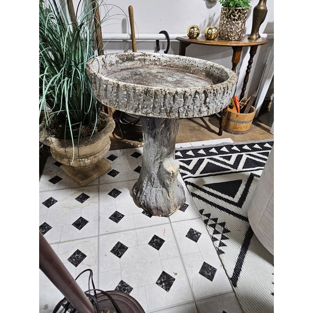 A stunning Tree Trunk Style Bird Bath. Standing approximately 25" tall; the top is secured on by a screw and is very...