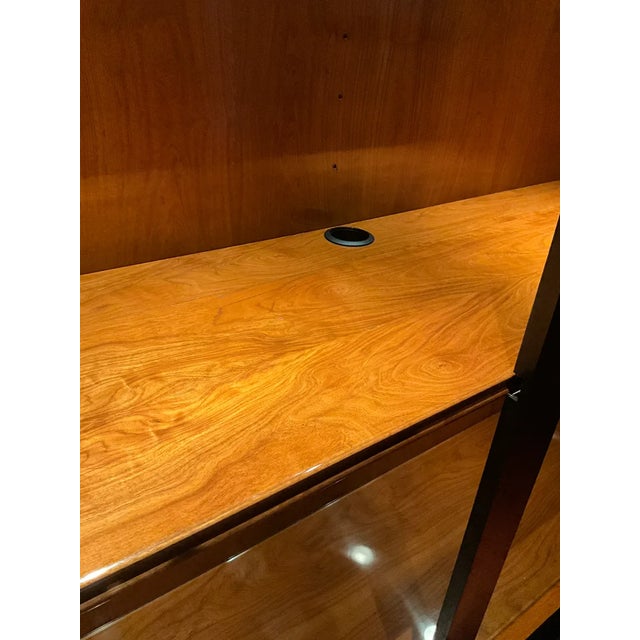 Monumental Italian black lacquer vitrine display cabinet featuring an illuminated wood-lined interior, adjustable glass...