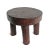 Vintage carved wood round four leg stool from West Africa. Signs of age and use with rich espresso finish.