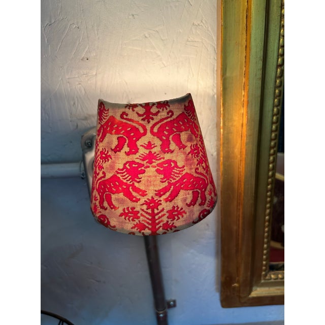 A plug in nightlight handmade with Fortuny’s iconic printed fabric