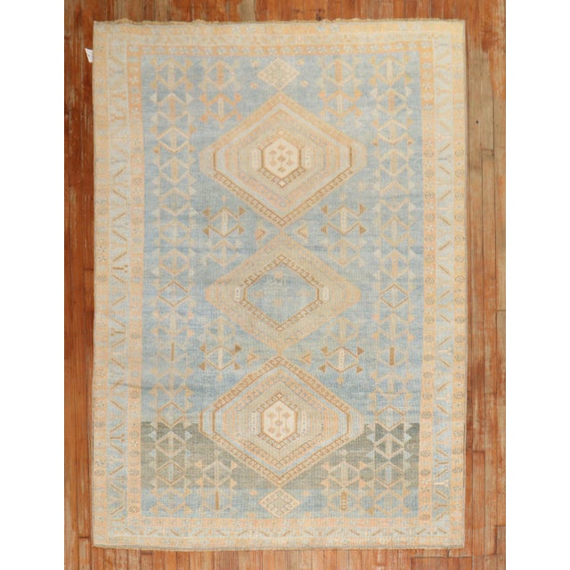 An early 20th century Persian Malayer tribal small room size rug in predominantly light blue Measures: 5'9" x 8'4'.