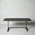 A strikingly handsome 19th century French table, featuring a substantial original slate top mounted on bold, architectural...