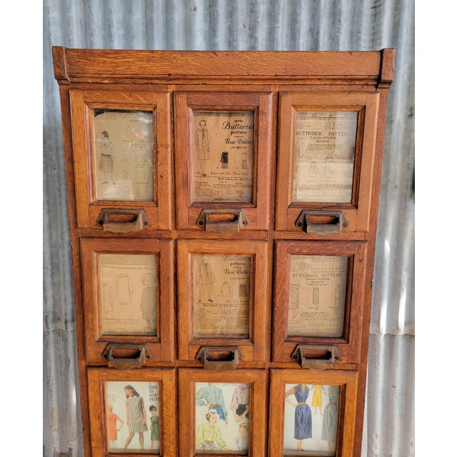 Very scarce American Tiger Oak commercial pattern cabinet. 15 glass front drawers for displaying and stocking clothing...