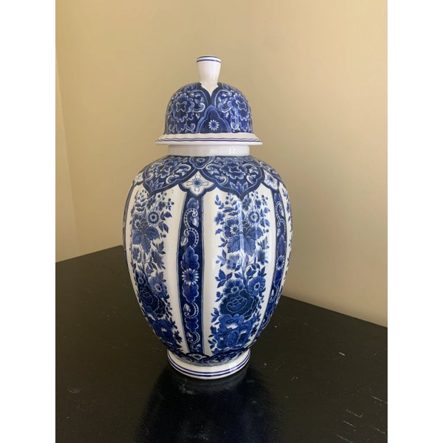A richly decorated blue and white porcelain ginger jar by Ardalt's Blue Delfia line, crafted in Italy during the mid-20th...