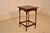 Circa 1900 period Edwardian oak side table from England. The top has a scalloped and beveled edge, surrounding a lovely...