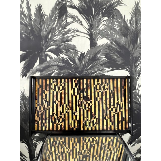 Organic modern tray in exotic tiger pen shell in striped hues of black, brown, and tan. The handcrafted tray features...