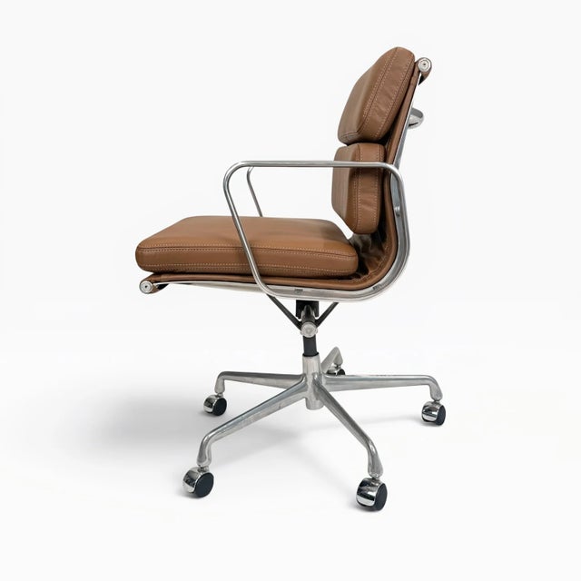 A beautifully restored Eames Aluminum Group Soft Pad Management Chair, originally designed by Charles & Ray Eames....