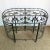 Ornate and timeless, this Maitland Smith-style console table features hand-forged wrought iron in a gracefully rounded...